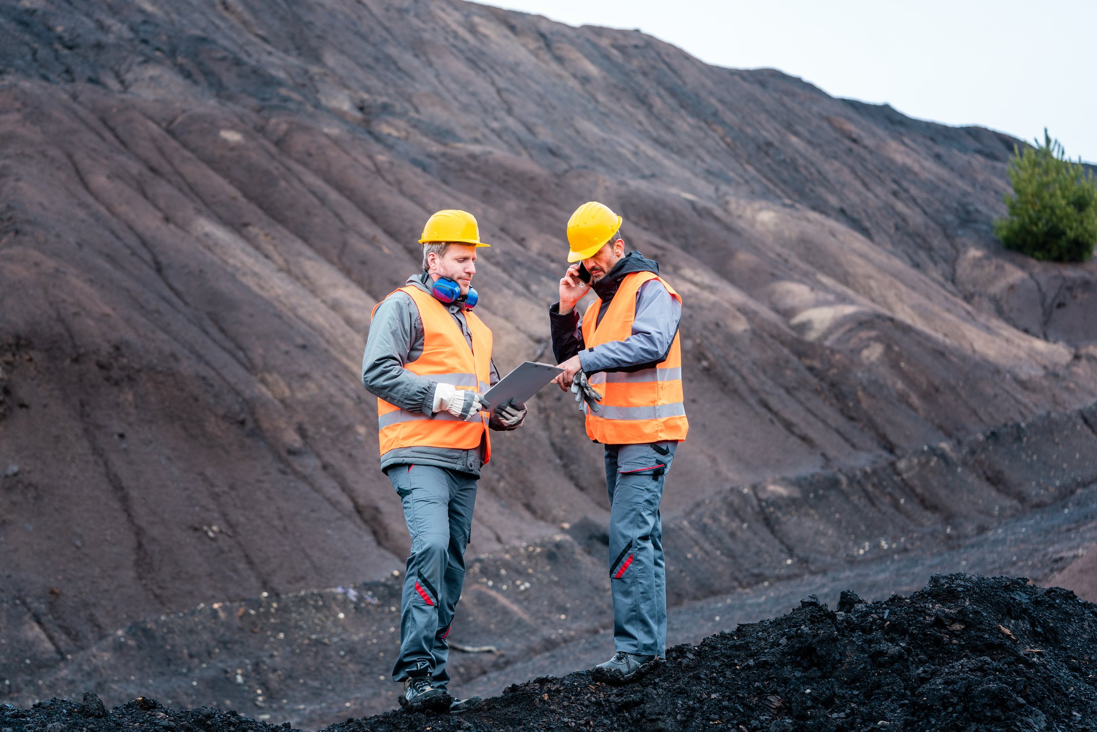 Workers in Open-Cast Mining Operation Pit